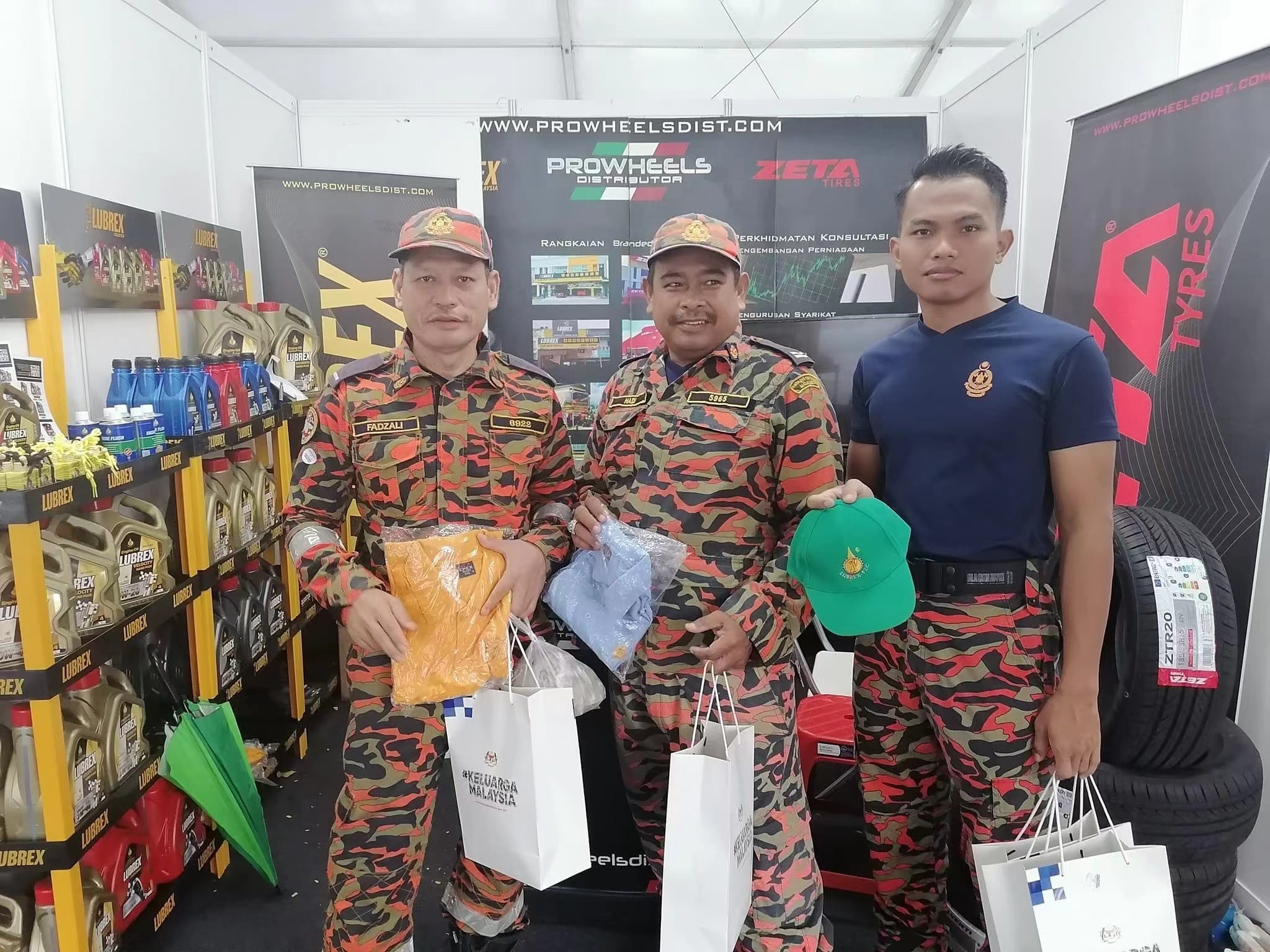 Heavy-duty lubricant products displayed on traditional metal racks in retail store