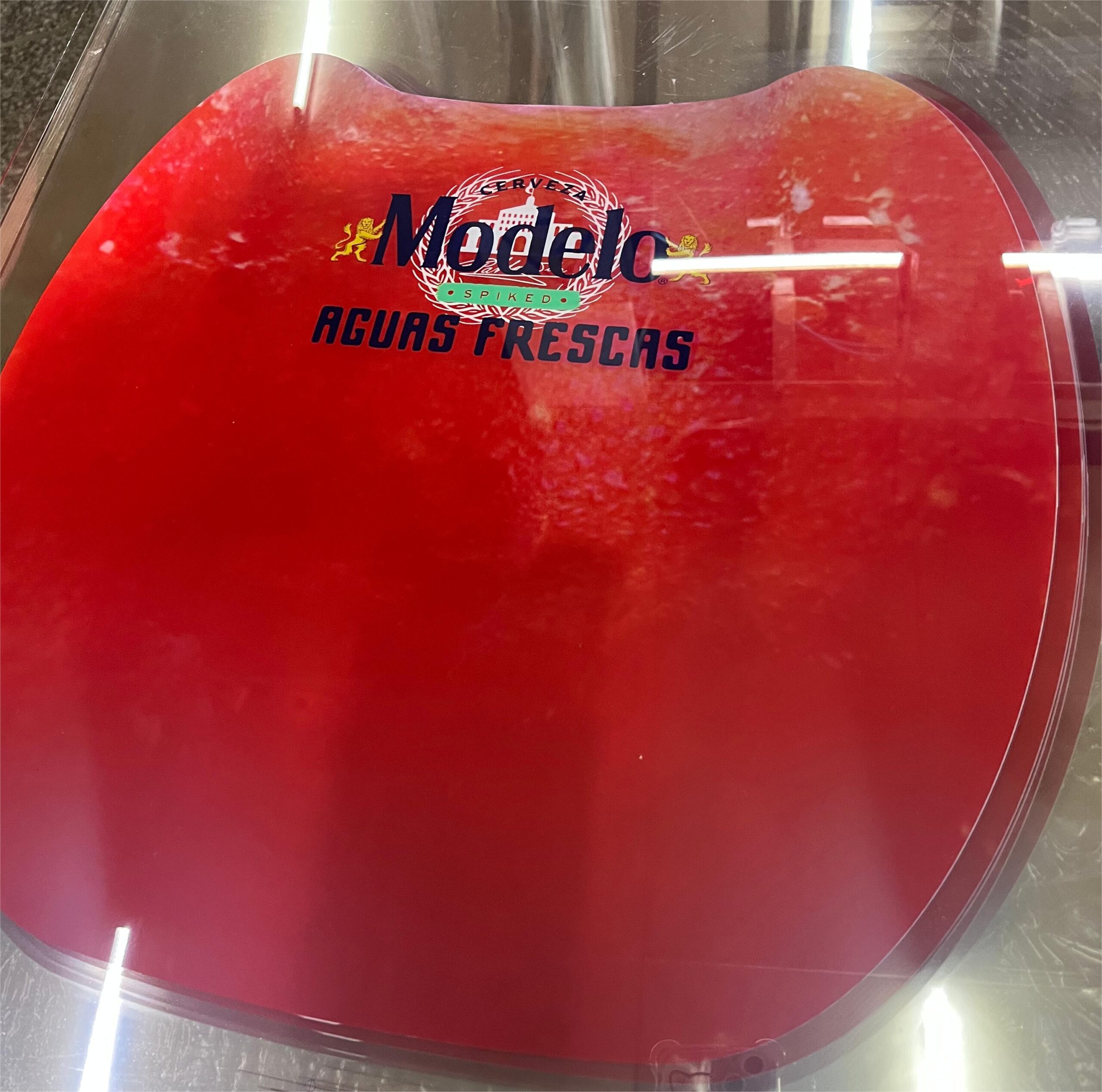 Pre-distorted printing on plastic sheet