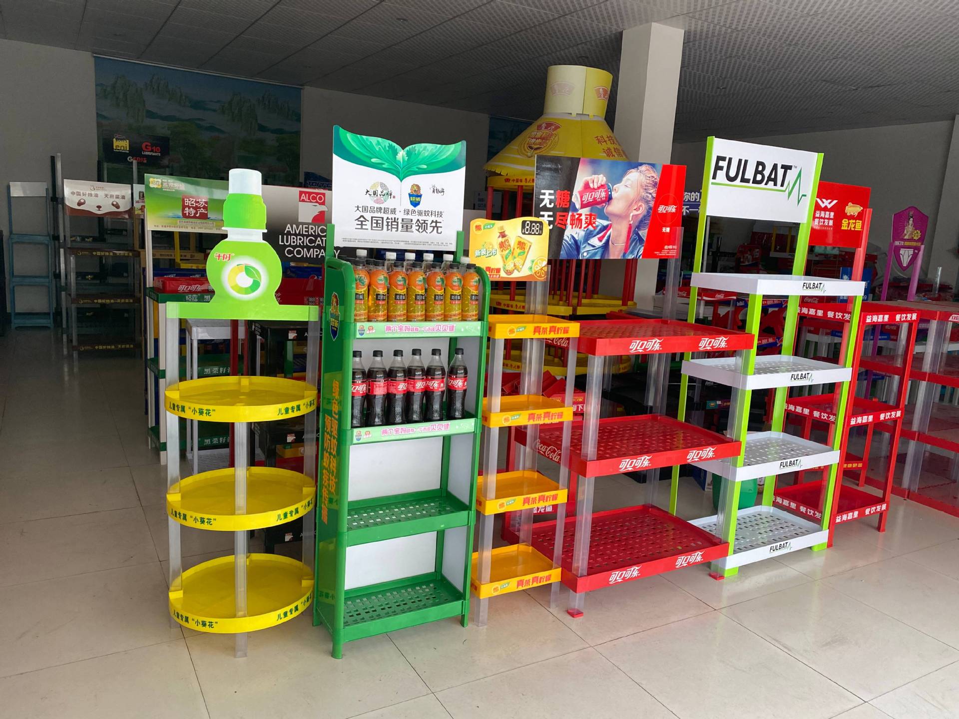 Multiple plastic display racks deployed across retail locations and outdoor promotional events