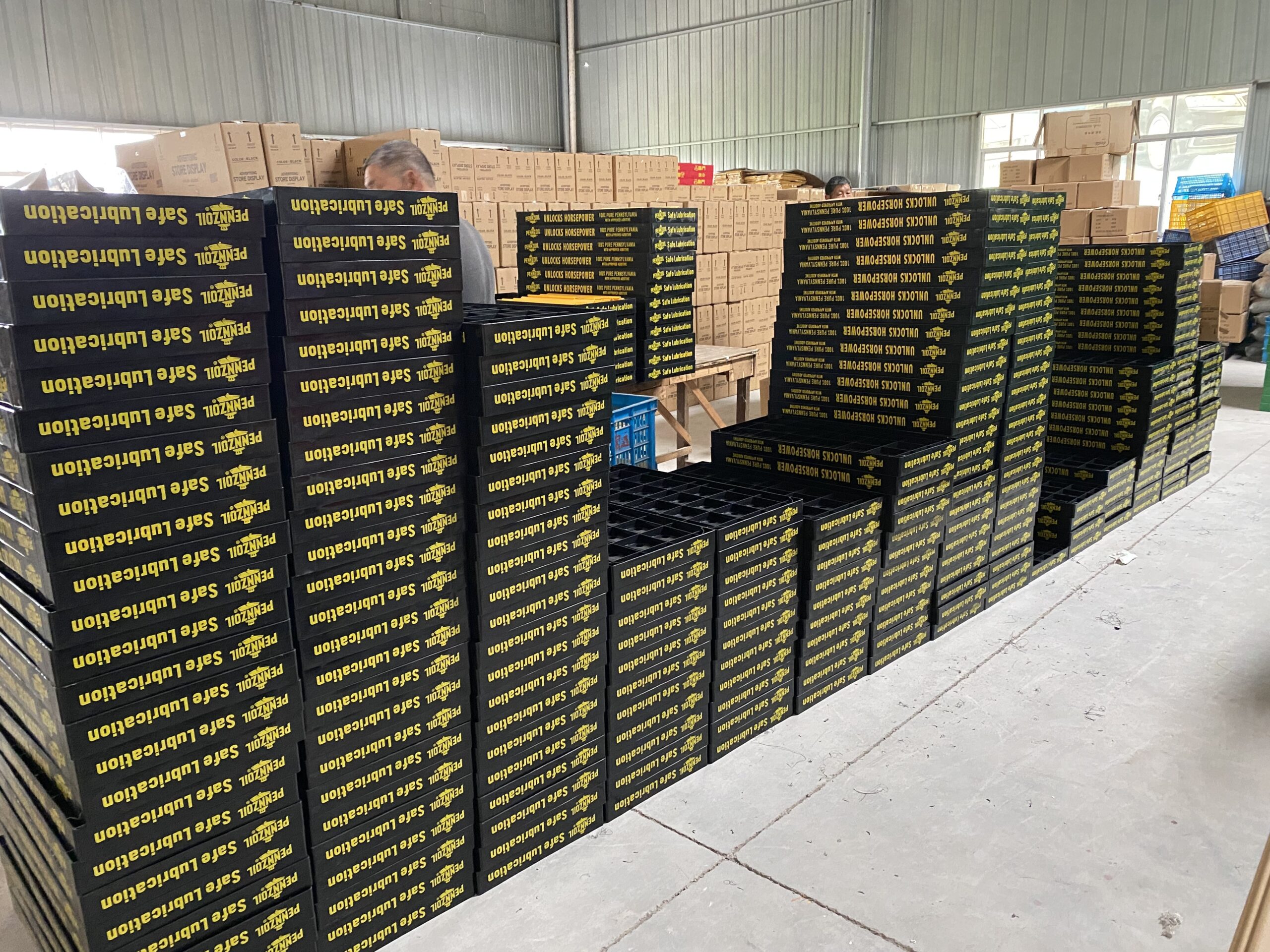 Assembly line with skilled workers assembling display racks