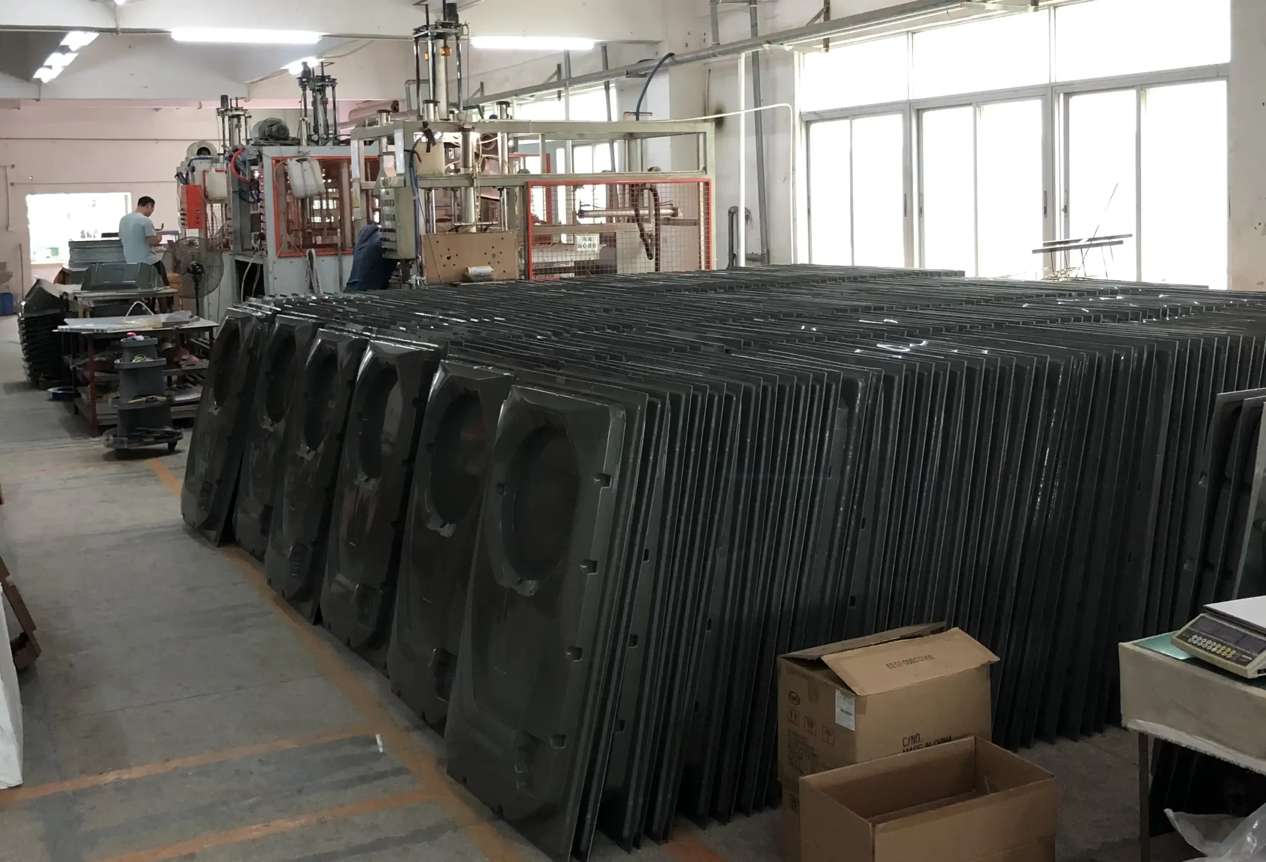 Large vacuum forming machine in operation